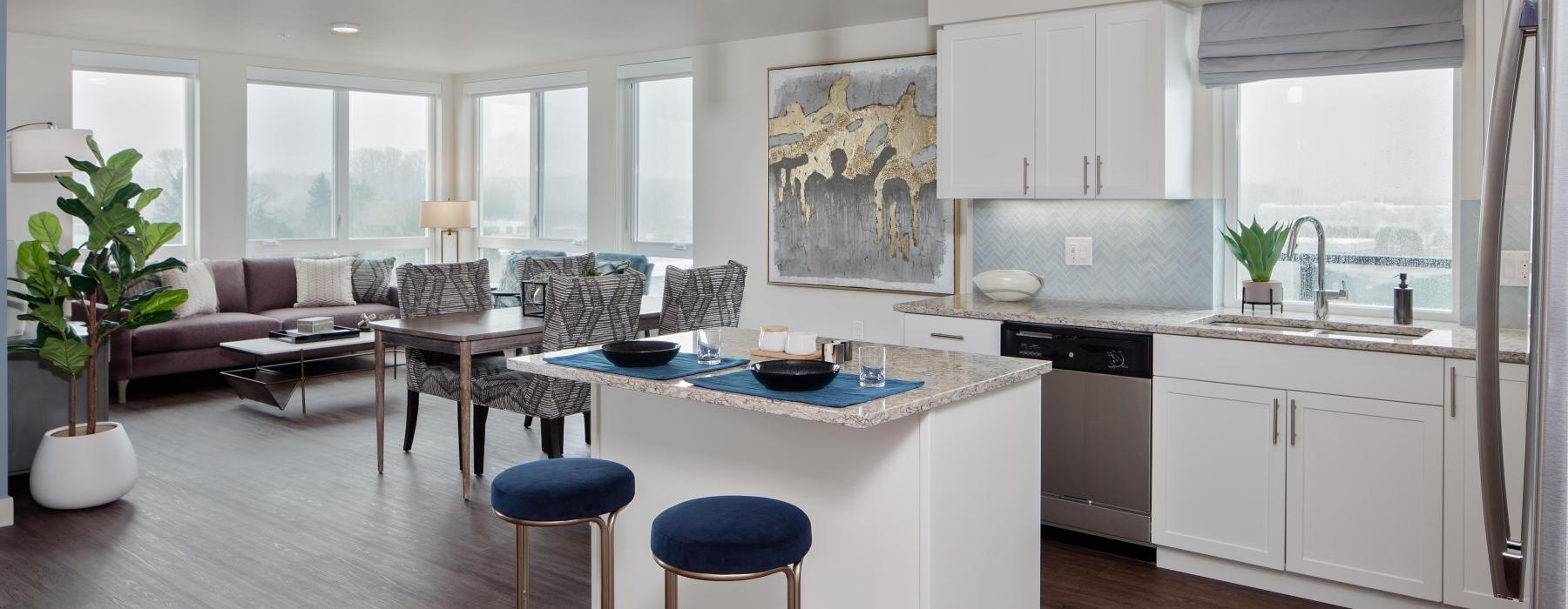 a kitchen with a bar and stools