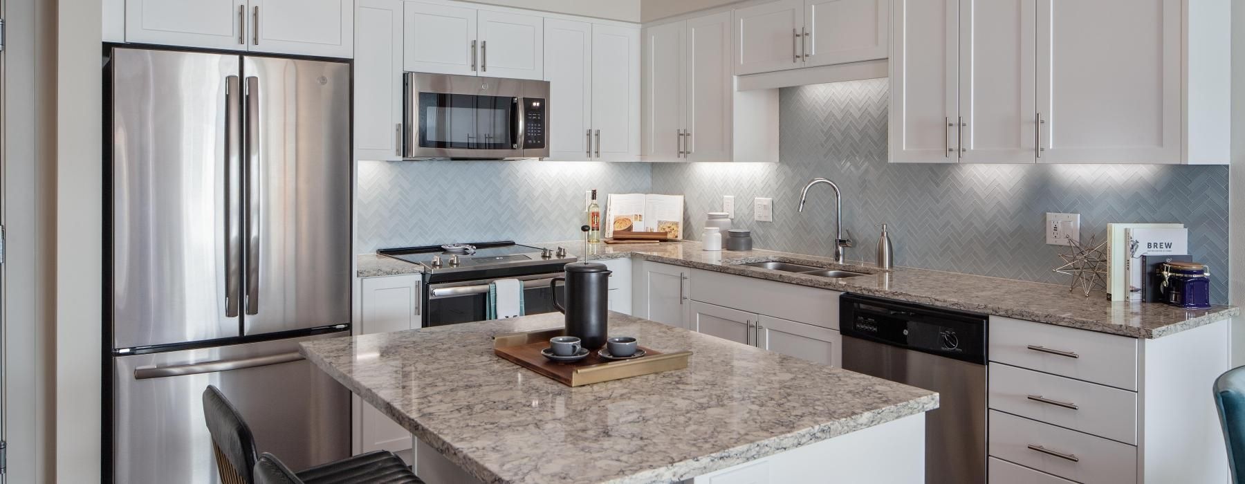 a kitchen with white cabinets