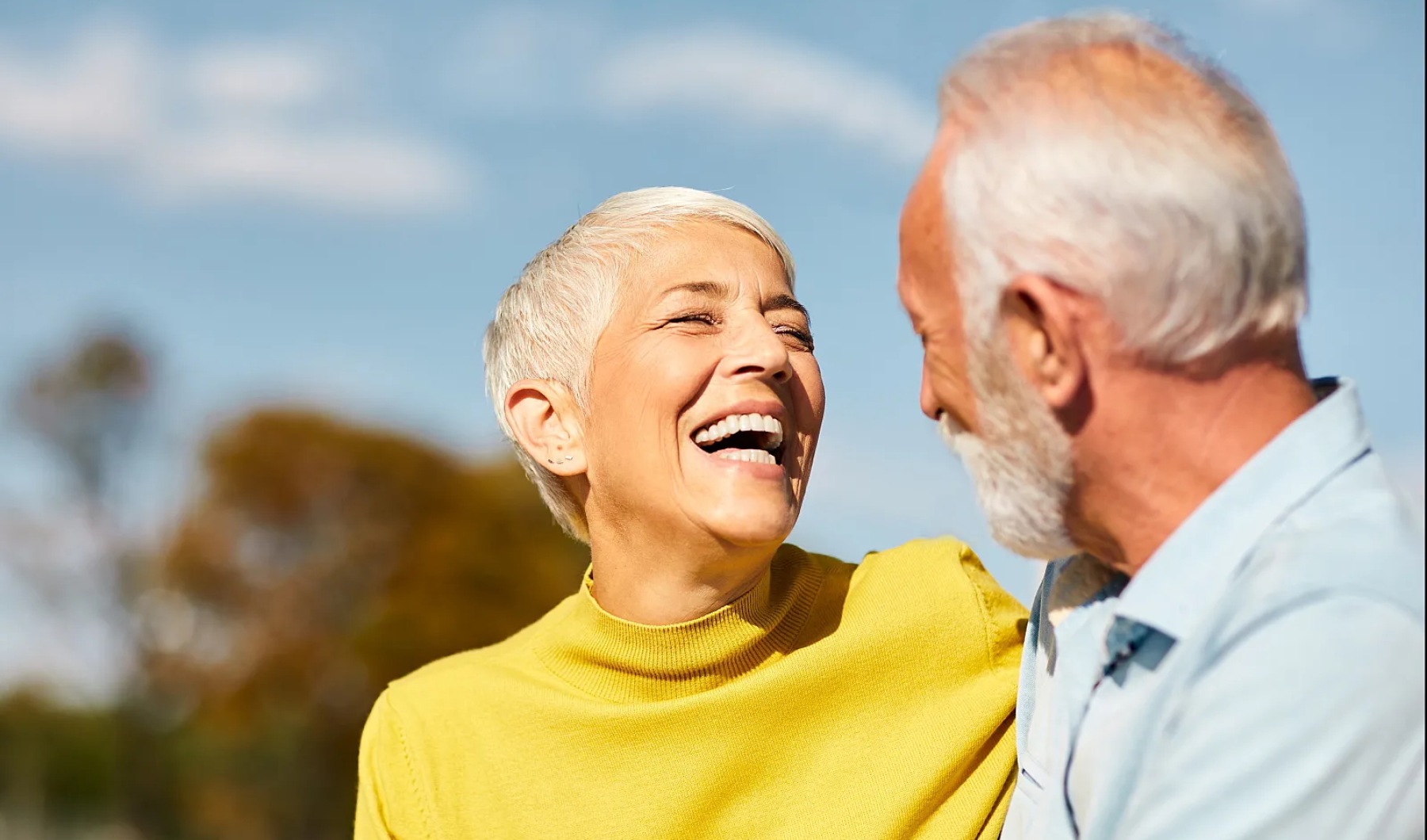 a  man and a woman laughing